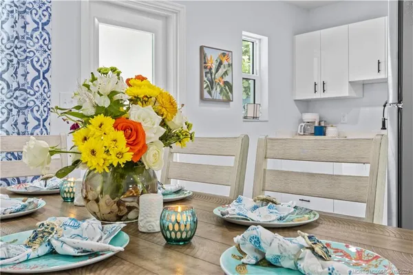 a kitchen with a sink and a potted plant