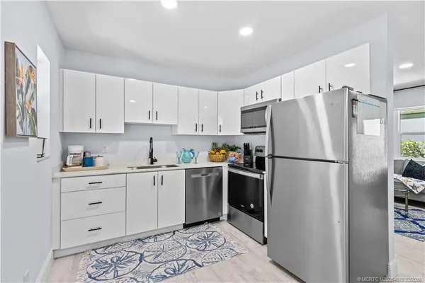 a bedroom with a bed lamp and a window