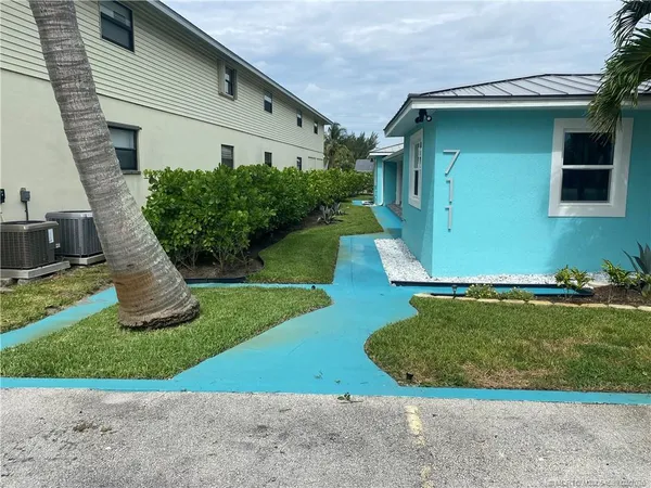 a view of a house with backyard porch and glass door