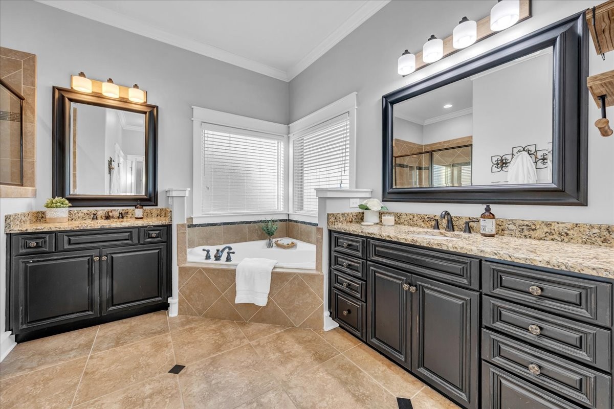 1021 Alice Springs Circle Spring Hill, TN 37174 - Photo 23 of 86 a spacious bathroom with a granite countertop sink a mirror a vanity and a