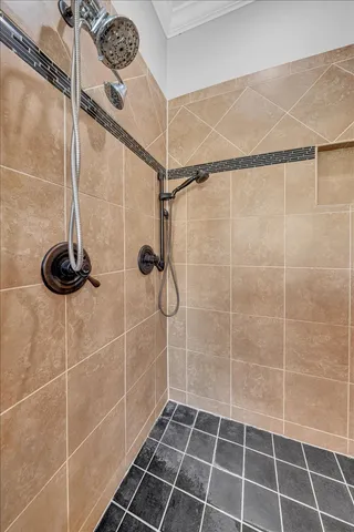 a spacious bathroom with a granite countertop sink mirror and shower