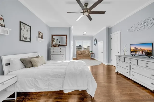 a patio with a table and chairs and potted plants