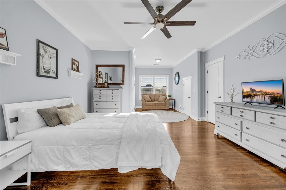 1021 Alice Springs Circle Spring Hill, TN 37174 - Photo 30 of 86 a spacious bedroom with a large bed and a flat tv screen on dresser