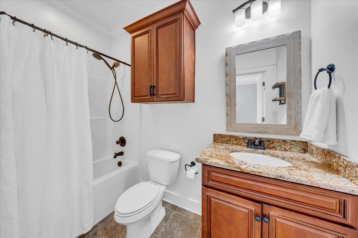 1021 Alice Springs Circle Spring Hill, TN 37174 - Photo 32 of 86 a bathroom with a granite countertop sink toilet and shower