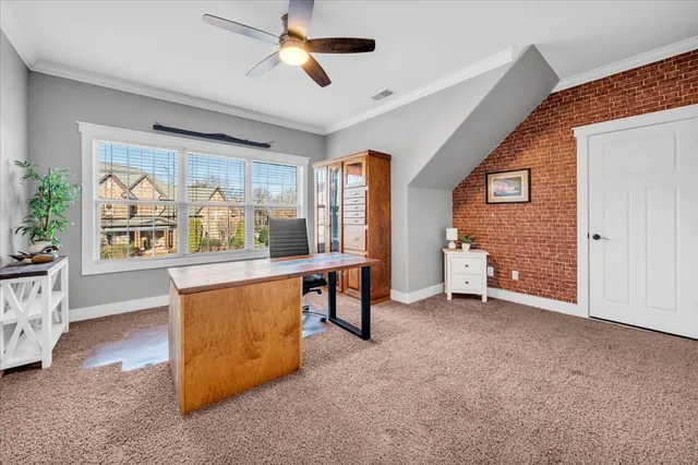 a bed room with a bed and a large window