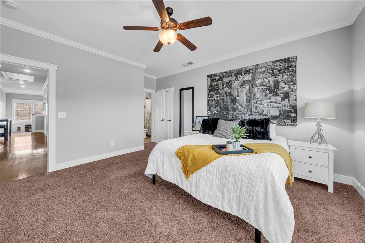 1021 Alice Springs Circle Spring Hill, TN 37174 - Photo 34 of 86 a bed room with a bed and a chandelier