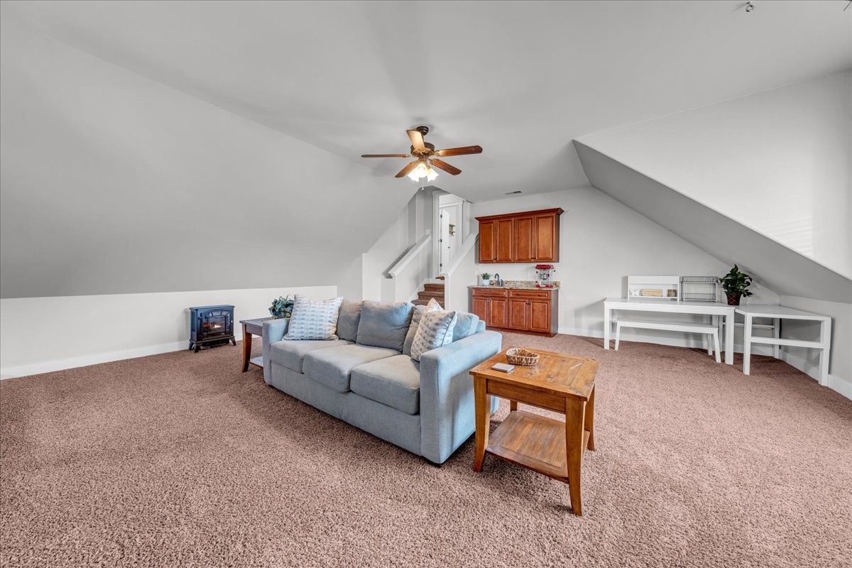1021 Alice Springs Circle Spring Hill, TN 37174 - Photo 36 of 86 a living room with furniture and a chandelier