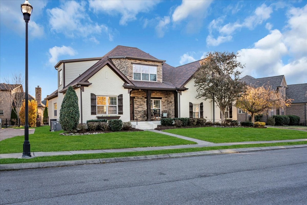 1021 Alice Springs Circle Spring Hill, TN 37174 - Photo 39 of 86 a front view of a house with a yard