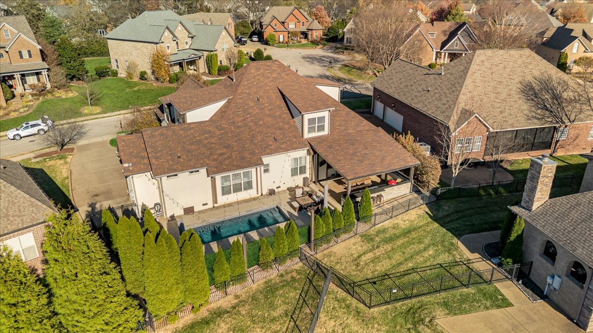 1021 Alice Springs Circle Spring Hill, TN 37174 - Photo 67 of 86 an aerial view of a house with swimming pool and large trees