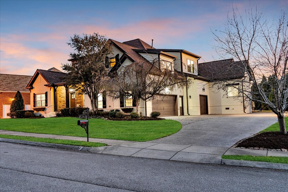1021 Alice Springs Circle Spring Hill, TN 37174 - Photo 7 of 86 a front view of a house with a yard and garage