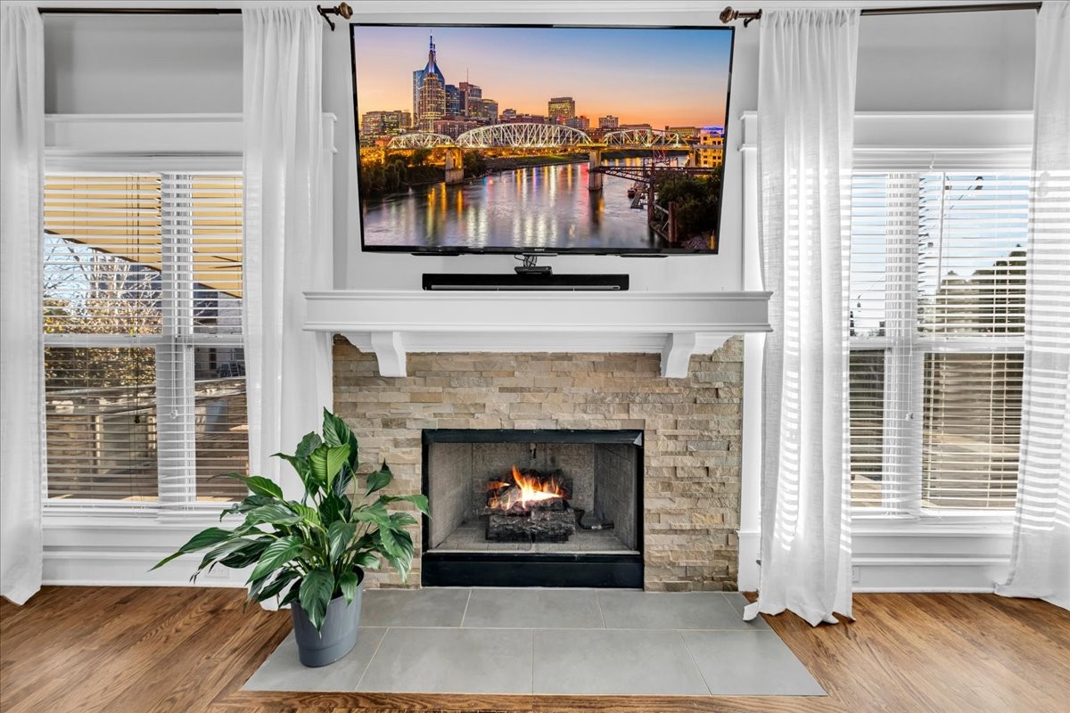 1021 Alice Springs Circle Spring Hill, TN 37174 - Photo 79 of 86 a living room with a fireplace with wooden floor