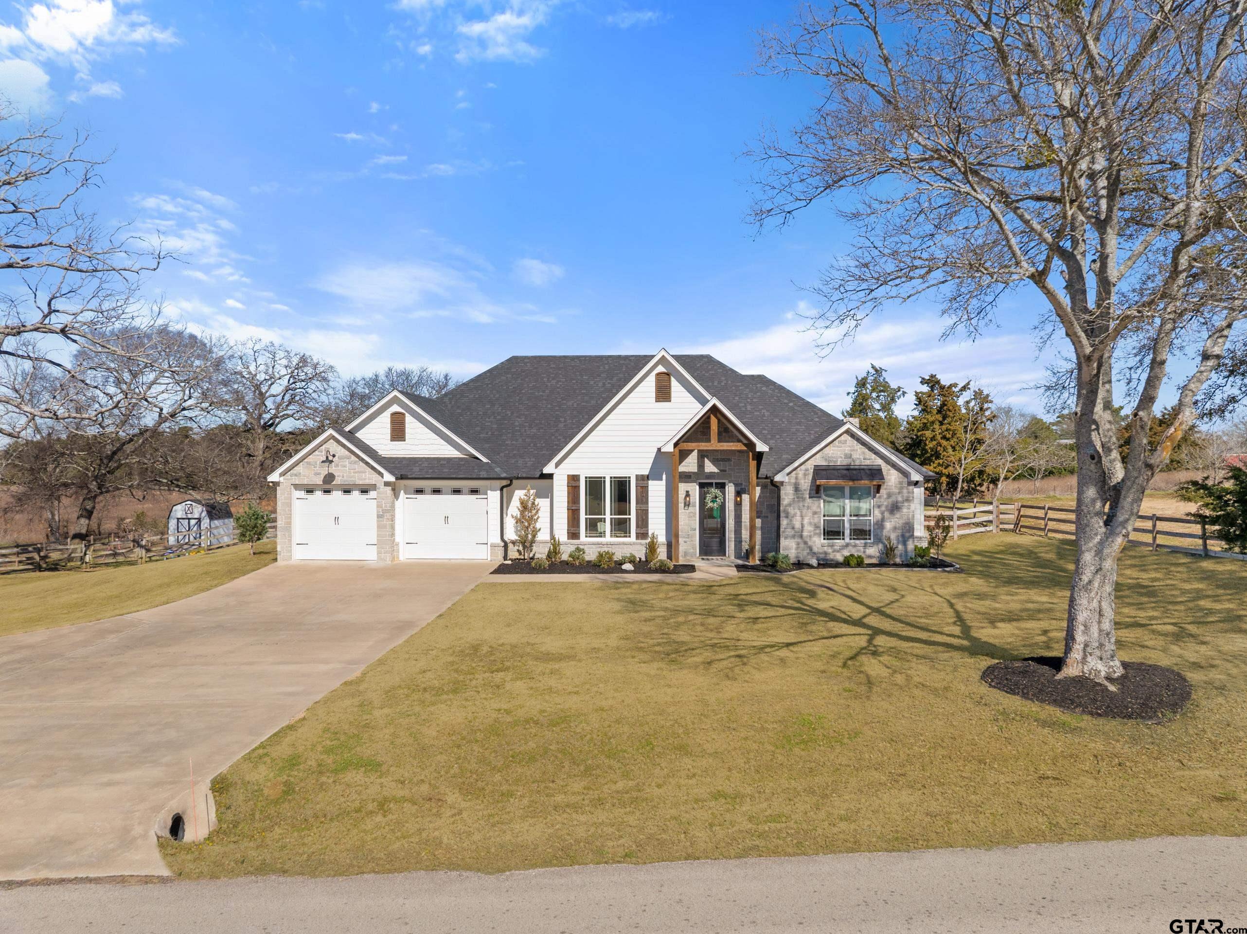 front view of a house with a yard