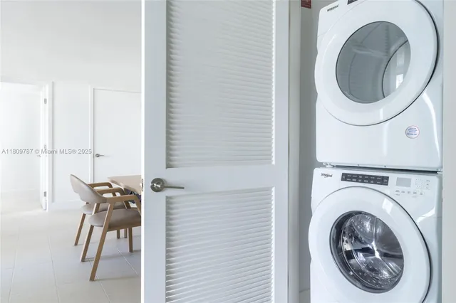 a close view of a utility room with dryer and washer