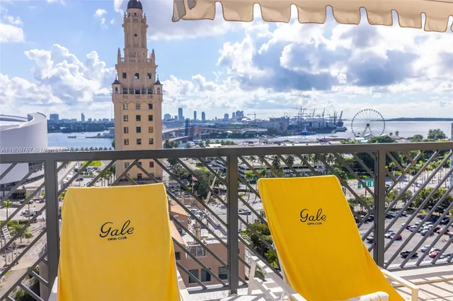 a view of a swimming pool with an outdoor space and seating area