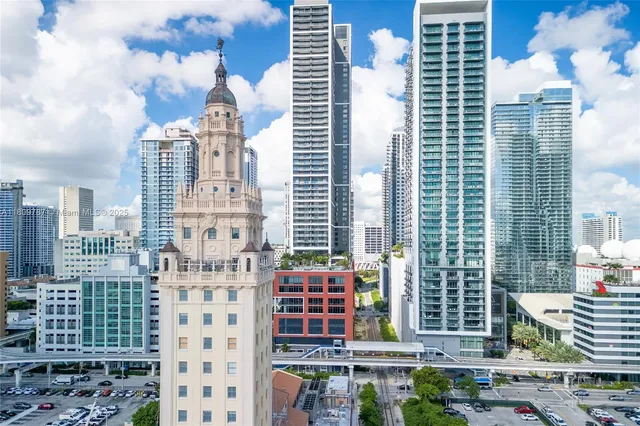 a living room view with furniture and a floor to ceiling window