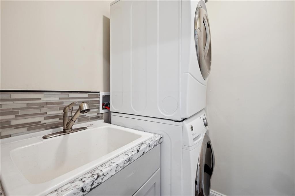 422 Grove Street McKees Rocks, PA 15136 - Photo 12 of 35 First-floor Laundry Room with utility tub. Washer/Dryer remain in the home.