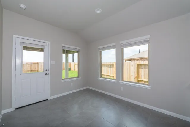 an empty room with windows