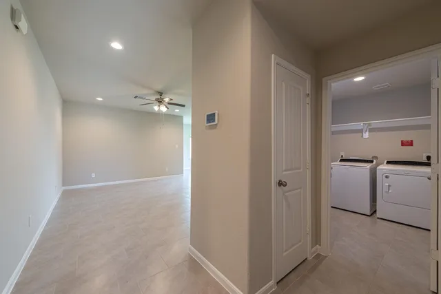 a view of a storage & utility room with closet