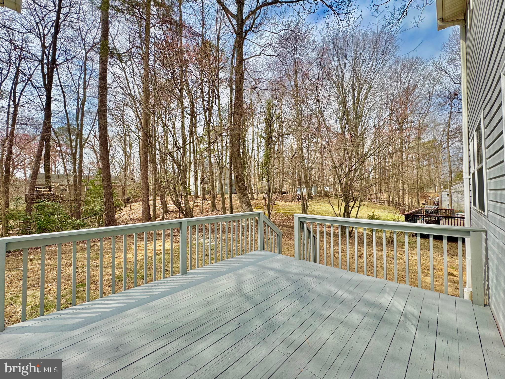 640 Santa Fe Trail Lusby, MD 20657 - Photo 11 of 26 a view of a roof deck with wooden floor and fence