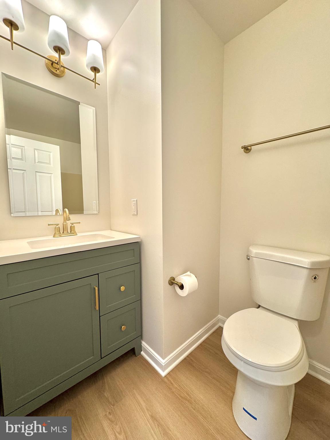 640 Santa Fe Trail Lusby, MD 20657 - Photo 14 of 26 a bathroom with a toilet a sink and mirror