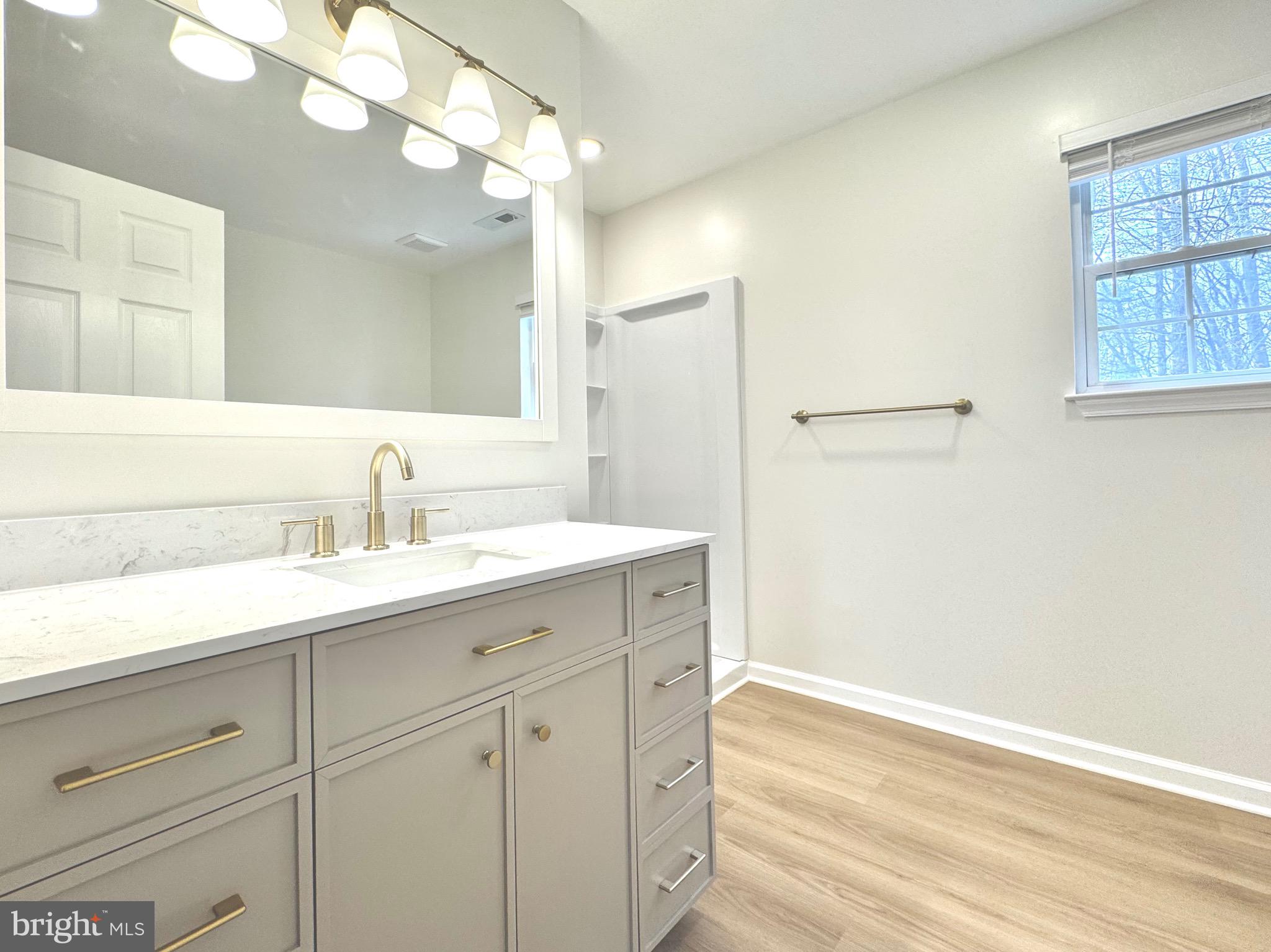 640 Santa Fe Trail Lusby, MD 20657 - Photo 17 of 26 a bathroom with a sink and a mirror