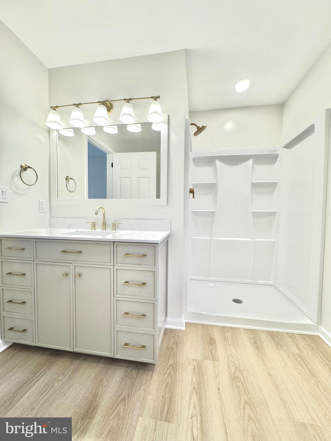 640 Santa Fe Trail Lusby, MD 20657 - Photo 18 of 26 a bathroom with a double vanity sink mirror and