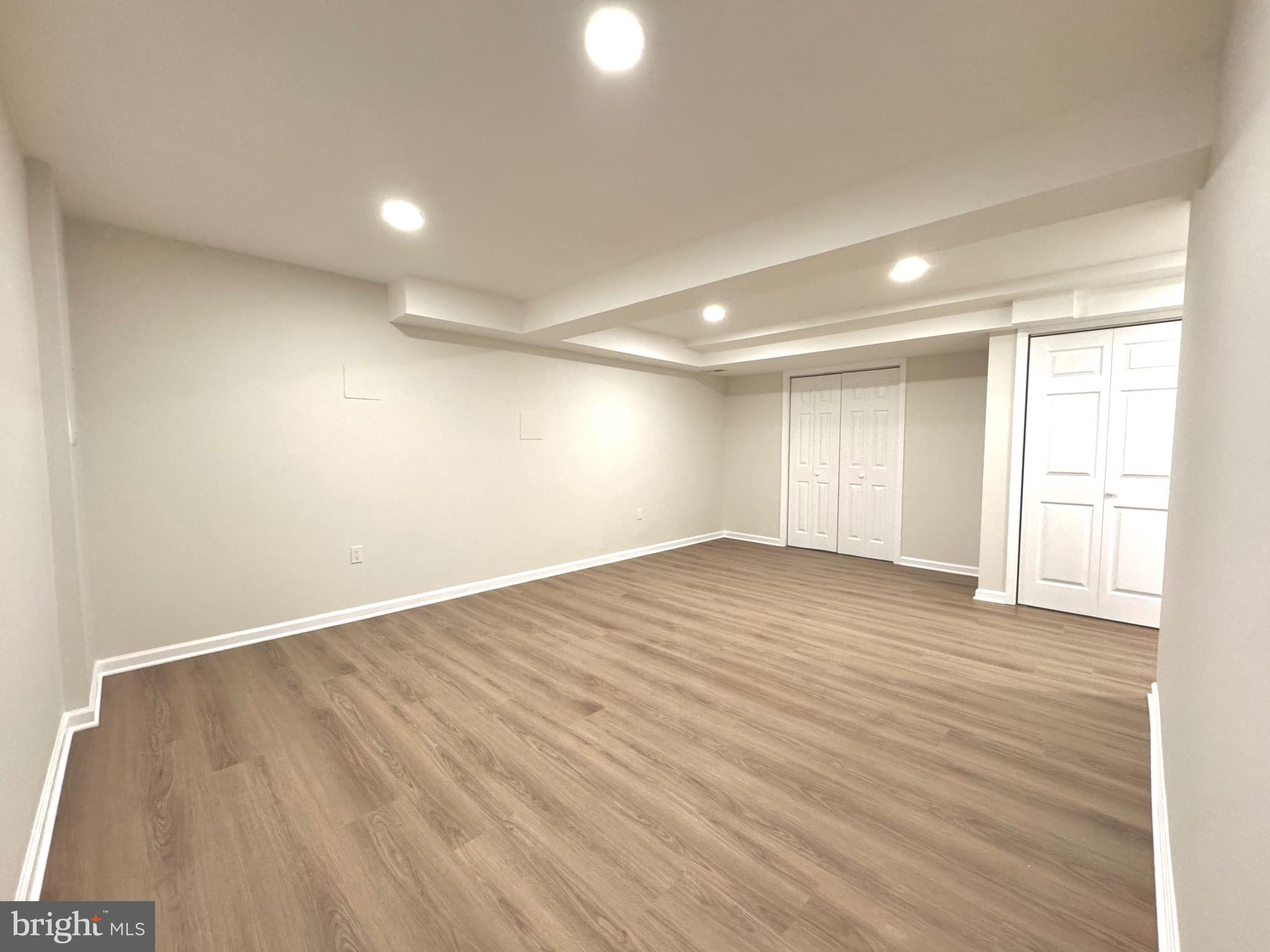 640 Santa Fe Trail Lusby, MD 20657 - Photo 25 of 26 an empty room with wooden floor and windows
