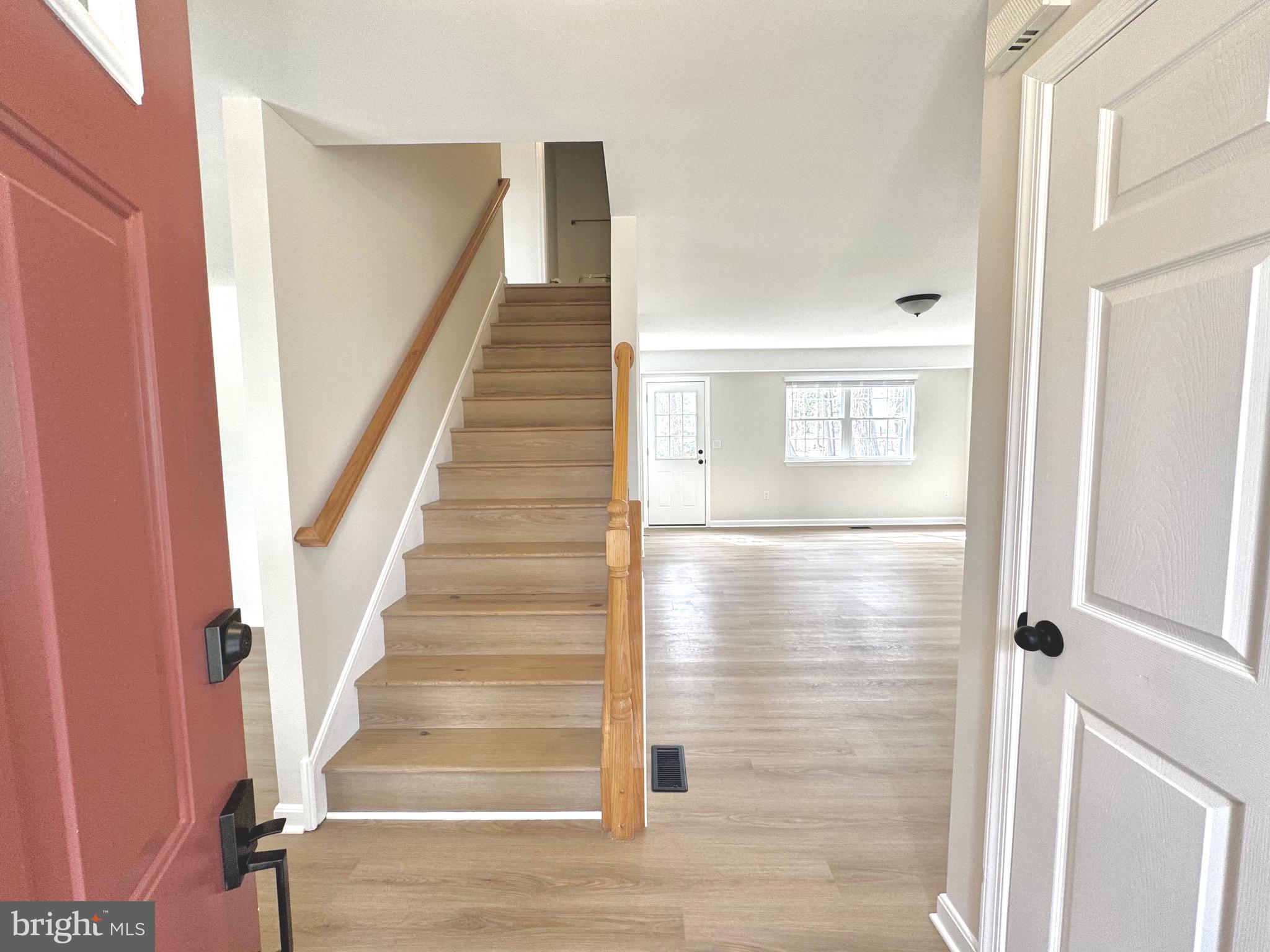 640 Santa Fe Trail Lusby, MD 20657 - Photo 3 of 26 a view of entryway with wooden floor and stairs