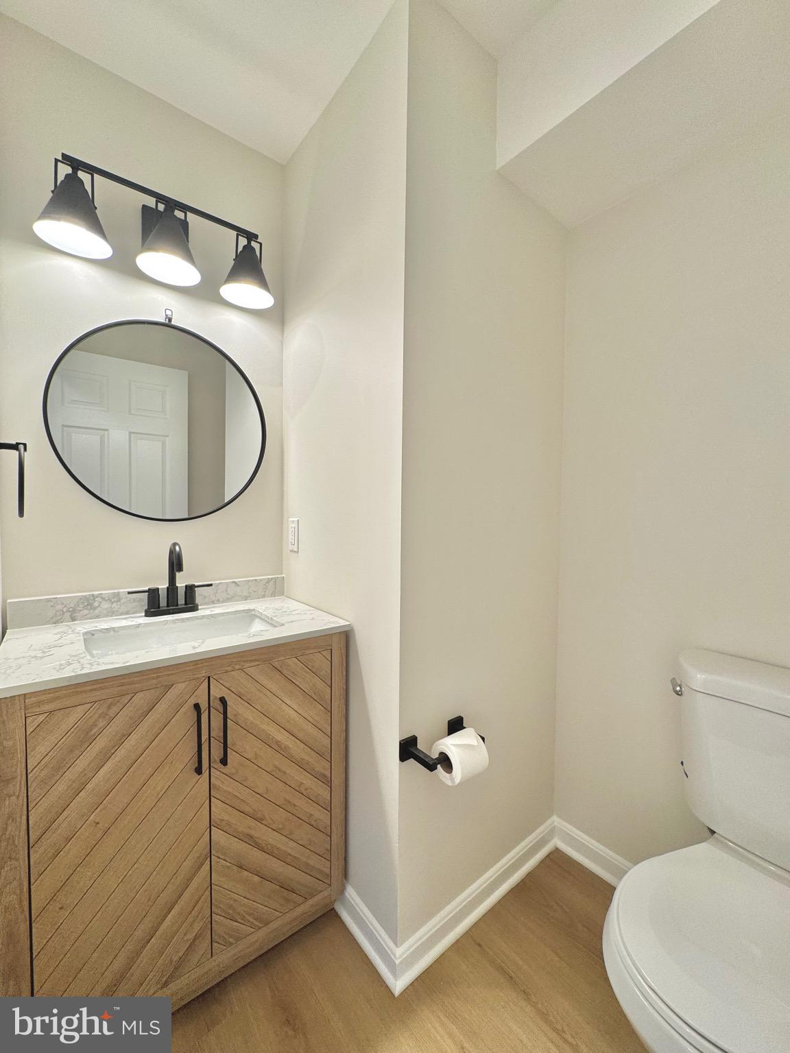 640 Santa Fe Trail Lusby, MD 20657 - Photo 6 of 26 a bathroom with a granite countertop toilet sink vanity and mirror