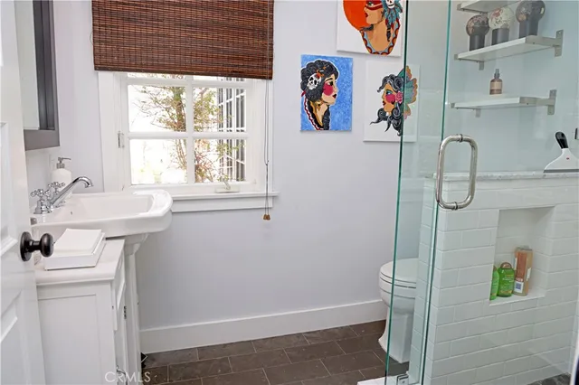 a bathroom with a sink and a window