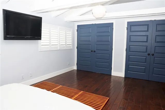 a view of room with wooden floor