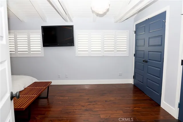 a room with wooden floor and a chair