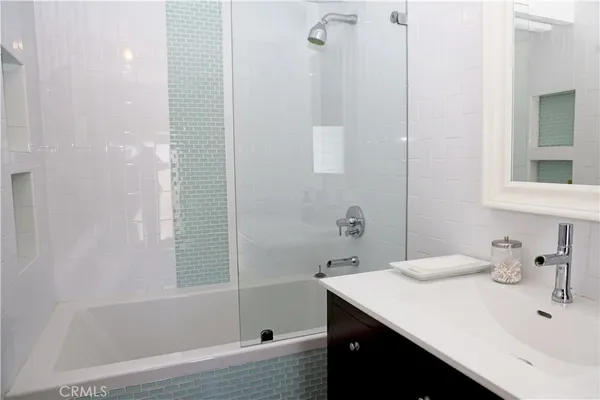 a bathroom with a sink and a bathtub