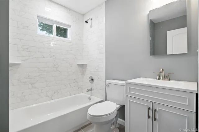 a bathroom with a sink a toilet and a bathtub