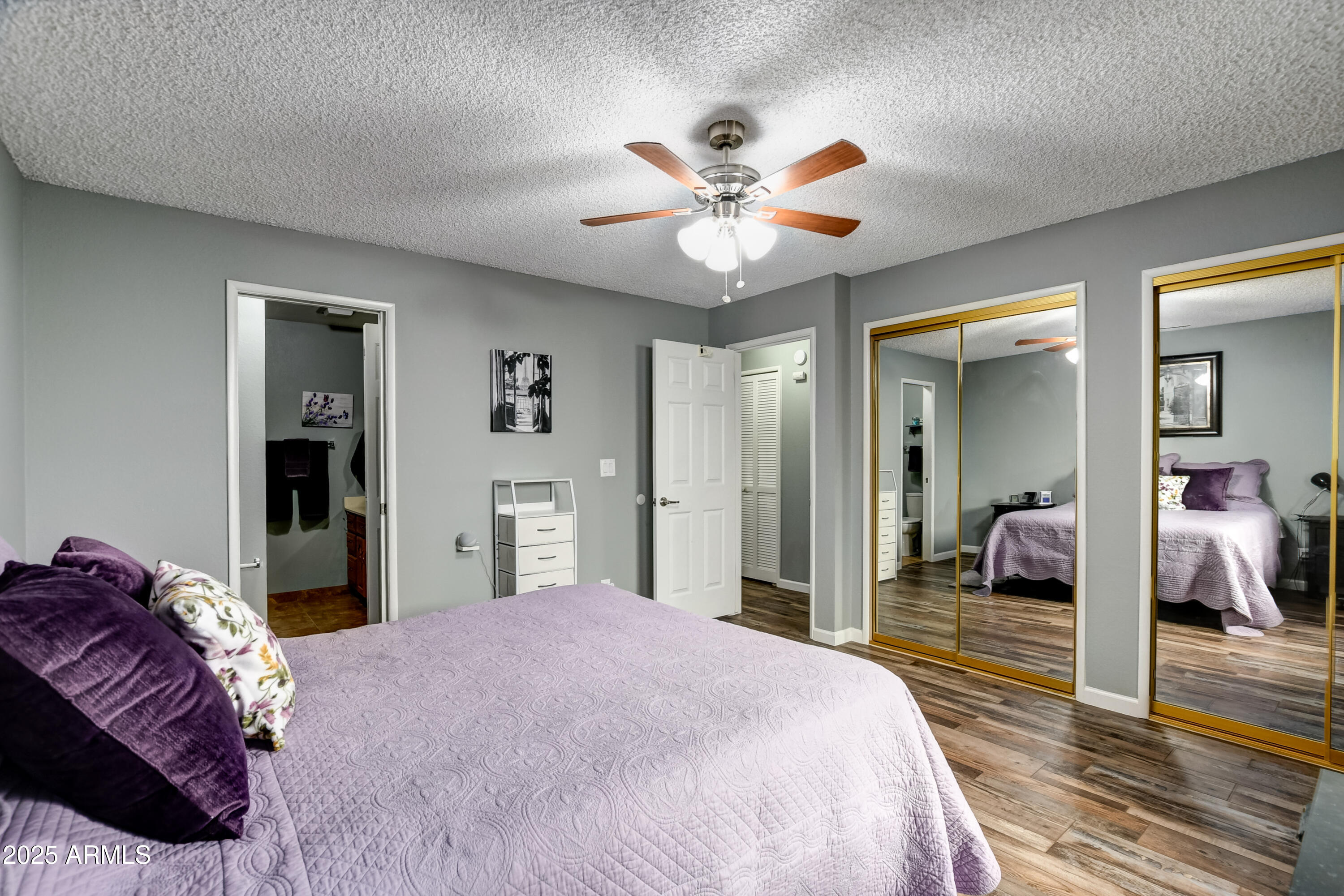 419 Apache Plume Trail Prescott, AZ 86301 - Photo 11 of 21 a bedroom with a large bed and a chandelier