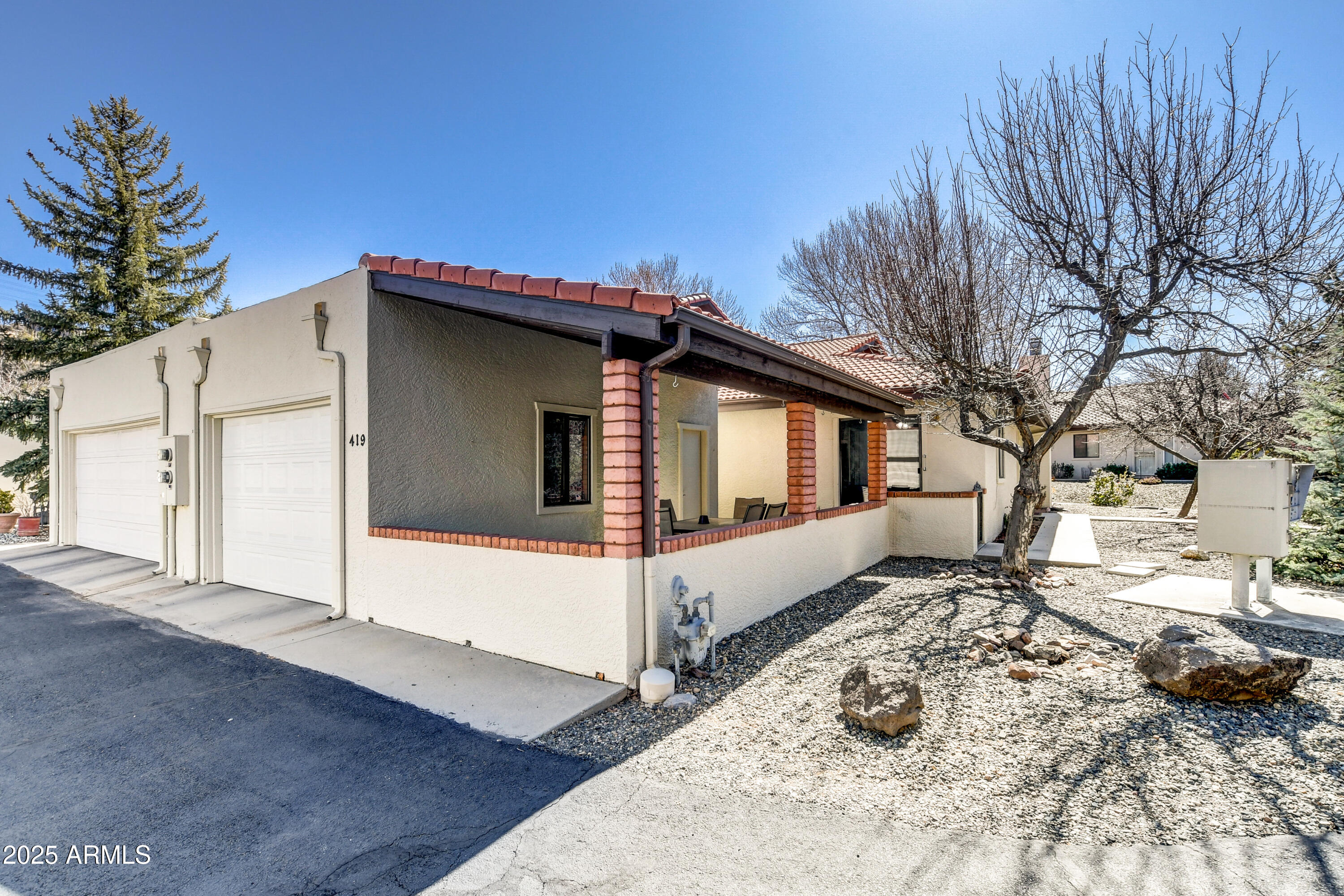 419 Apache Plume Trail Prescott, AZ 86301 - Photo 15 of 21 a view of a house with a yard covered in snow
