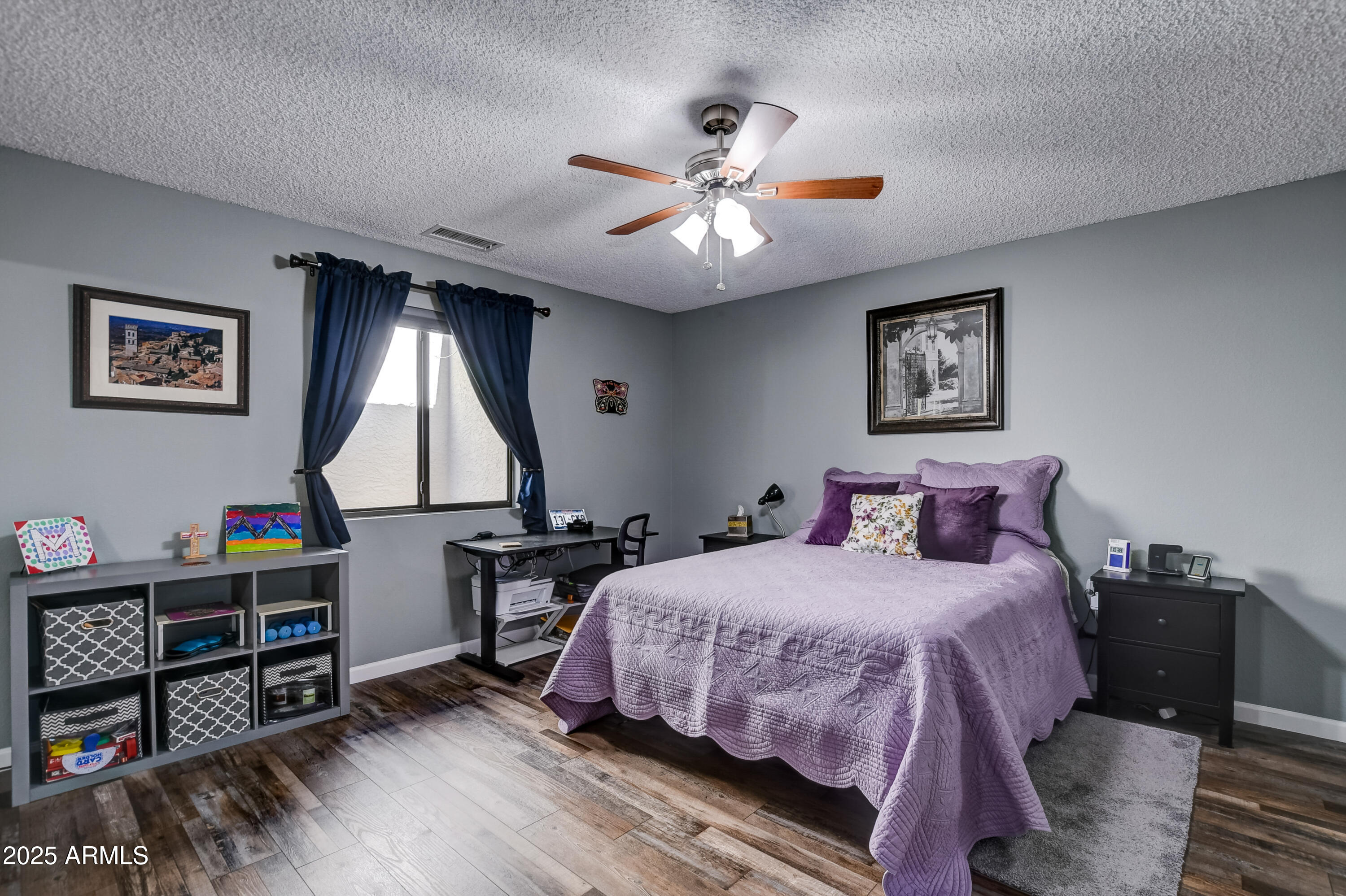 419 Apache Plume Trail Prescott, AZ 86301 - Photo 10 of 21 a bedroom with a bed and a chandelier