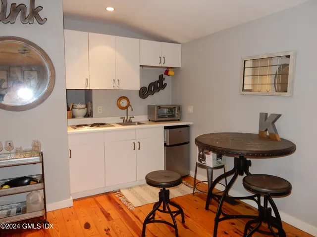 a kitchen with stainless steel appliances a stove a sink and a refrigerator