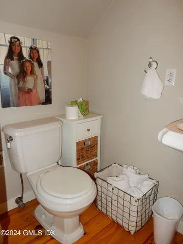 a white toilet sitting next to a bathroom sink