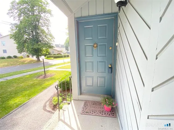 a view of an entryway with a garden