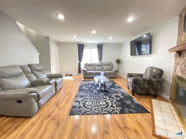 a living room with furniture and a rug