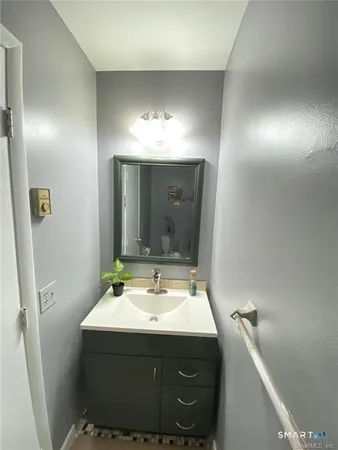 a bathroom with a sink and mirror