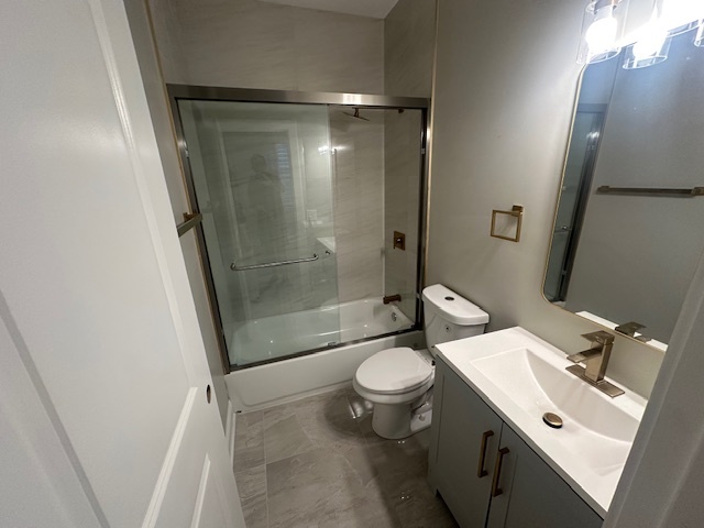 5743 South Emerald Avenue Chicago, IL 60621 - Photo 14 of 28 a bathroom with a sink toilet and shower