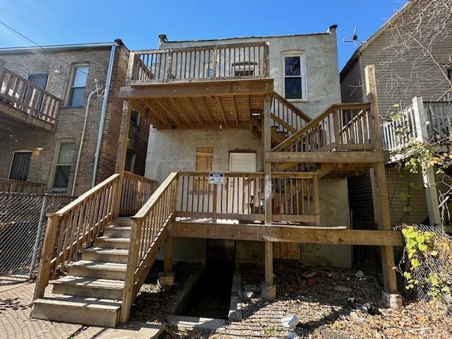 5743 South Emerald Avenue Chicago, IL 60621 - Photo 22 of 28 a view of a house with a deck