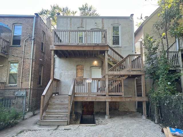5743 South Emerald Avenue Chicago, IL 60621 - Photo 23 of 28 a view of house with roof deck and seating space