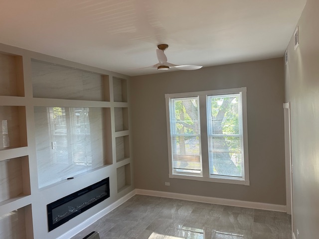 5743 South Emerald Avenue Chicago, IL 60621 - Photo 3 of 28 an empty room with windows