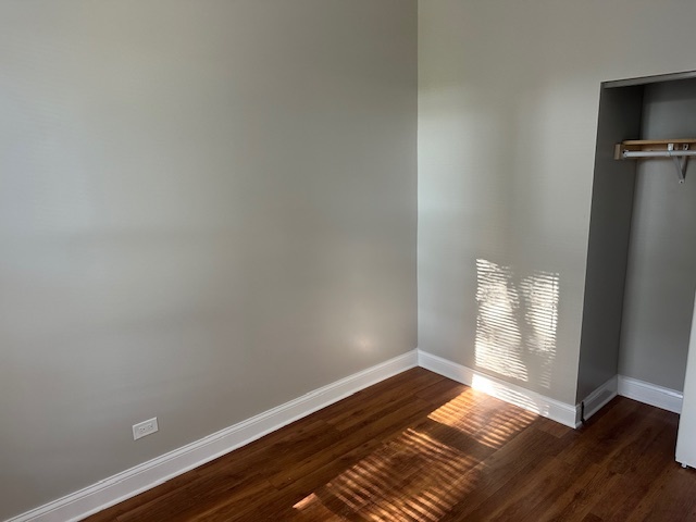 5743 South Emerald Avenue Chicago, IL 60621 - Photo 4 of 28 a view of empty room with wooden floor and fan