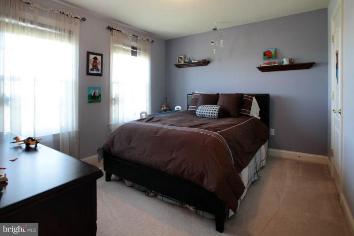 19505 Middletown Road Freeland, MD 21053 - Photo 25 of 30 a bed sitting in a bedroom next to a window