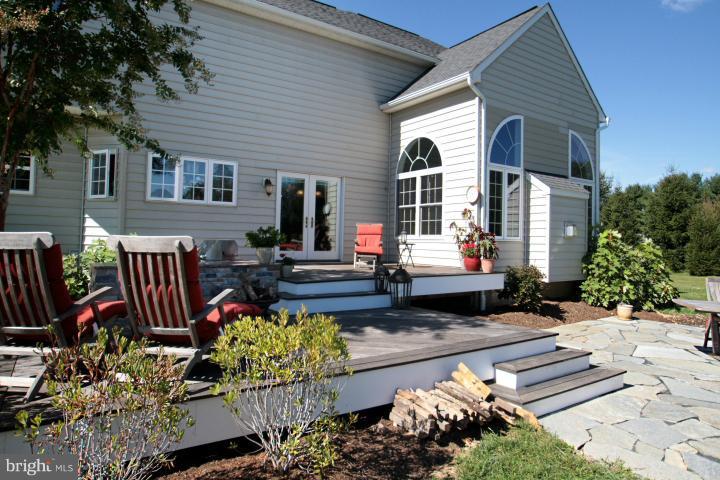 19505 Middletown Road Freeland, MD 21053 - Photo 28 of 30 a front view of a house with a garden and patio