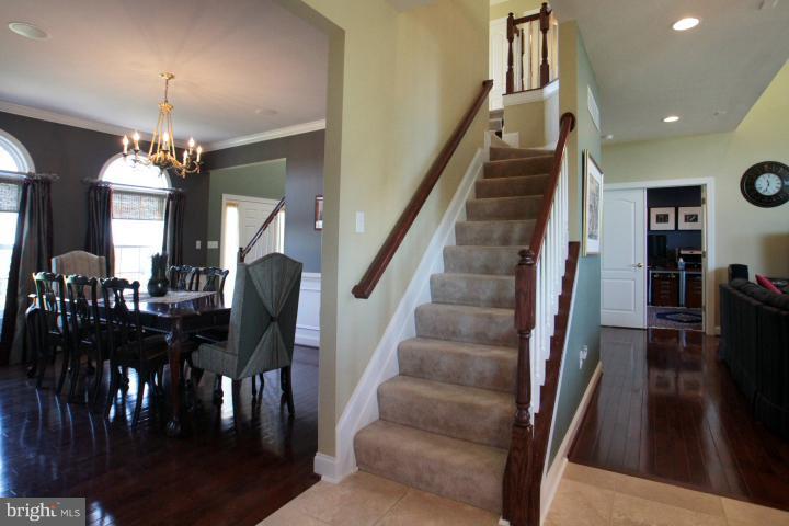 19505 Middletown Road Freeland, MD 21053 - Photo 7 of 30 a view of a dining room with furniture and a chandelier